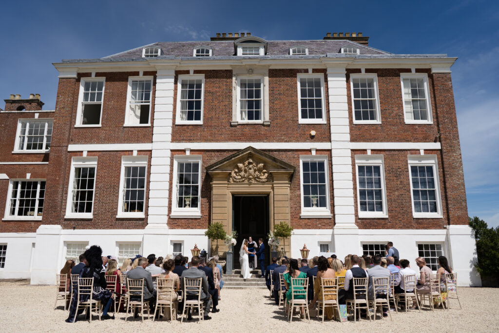 Outdoor ceremony at country house wedding venue