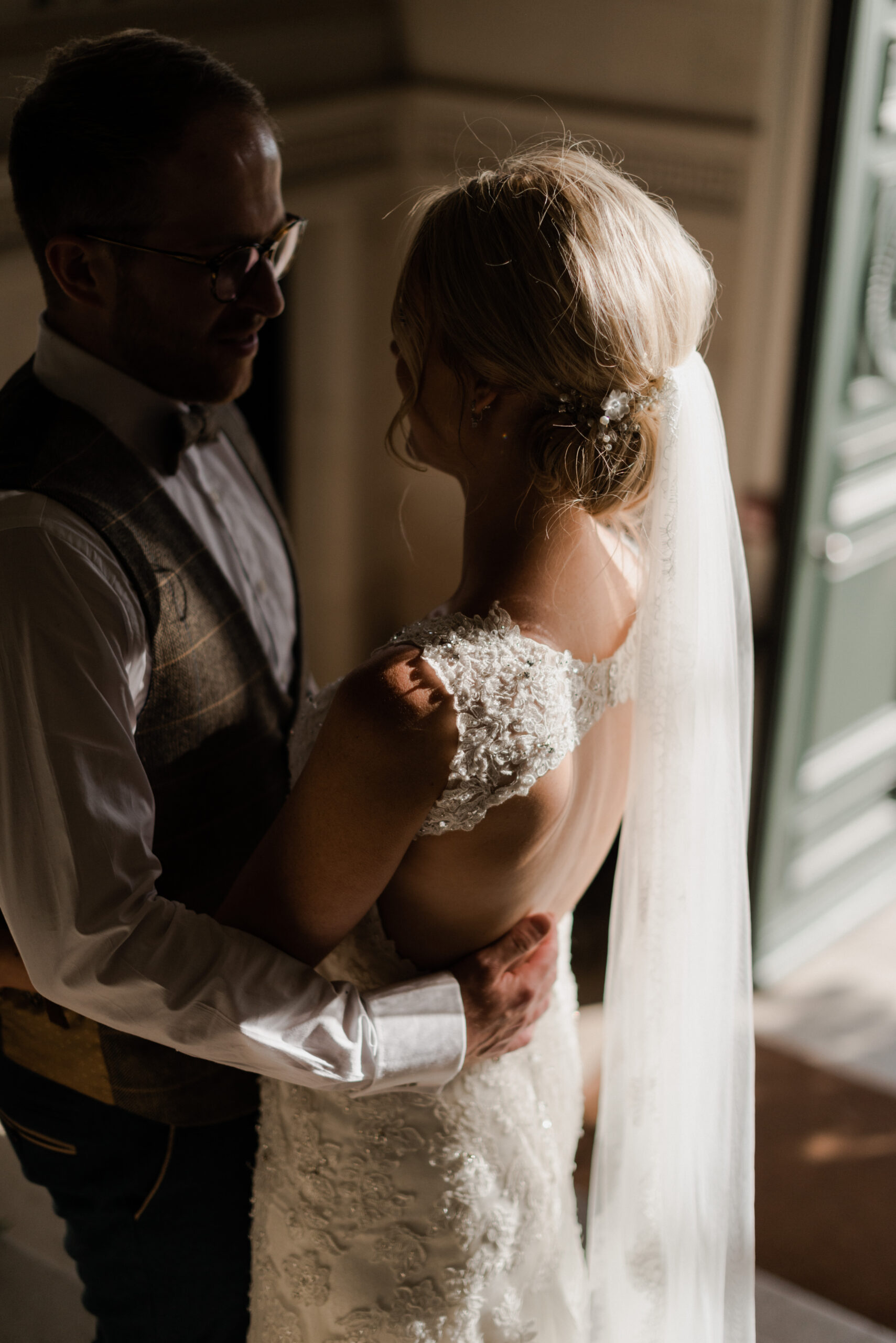 Bride and groom embracing.