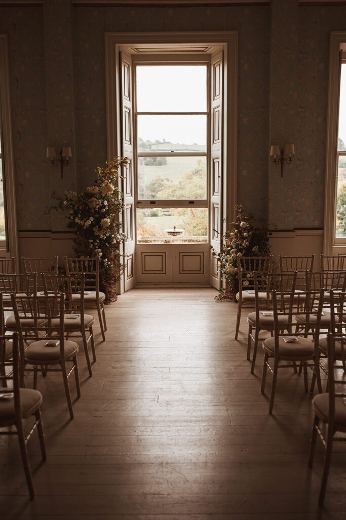 Two floral arches as wedding ceremony backdrop.