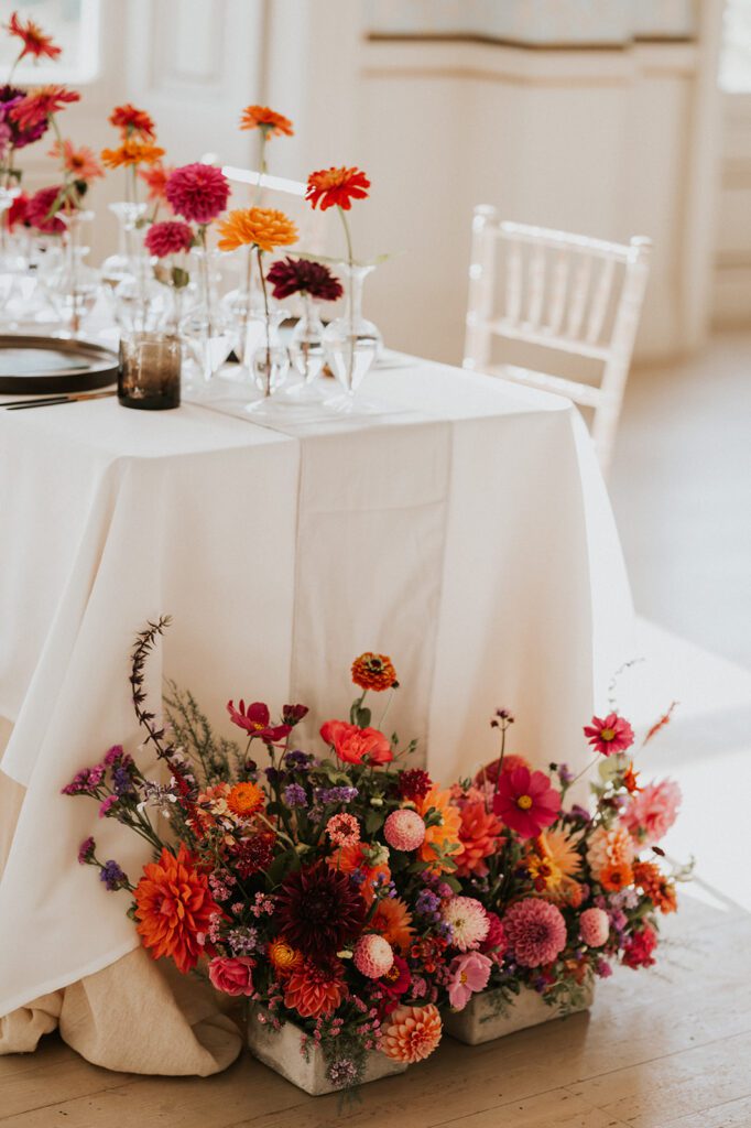 Floral arrangement of brightly coloured wedding flowers.