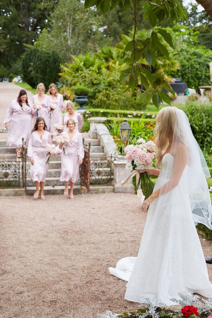 Bride with Bridesmaids at English wedding venue.
