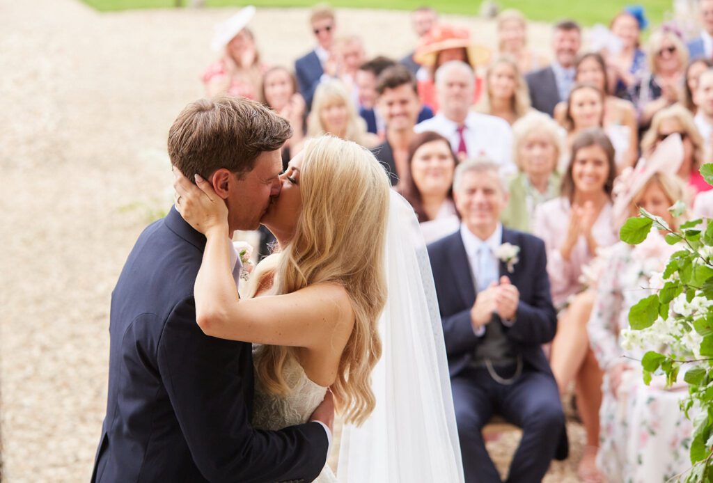 First kiss during English wedding ceremony.