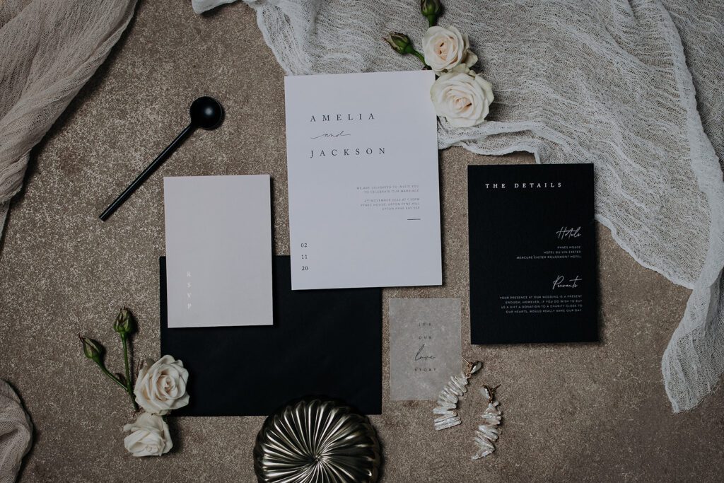 Flat lay of wedding stationery.