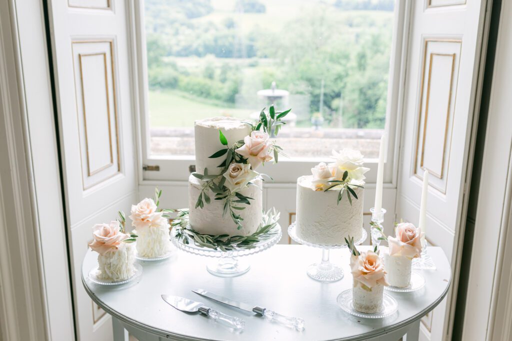 Classic English cake table, at luxury wedding venue in Devon.