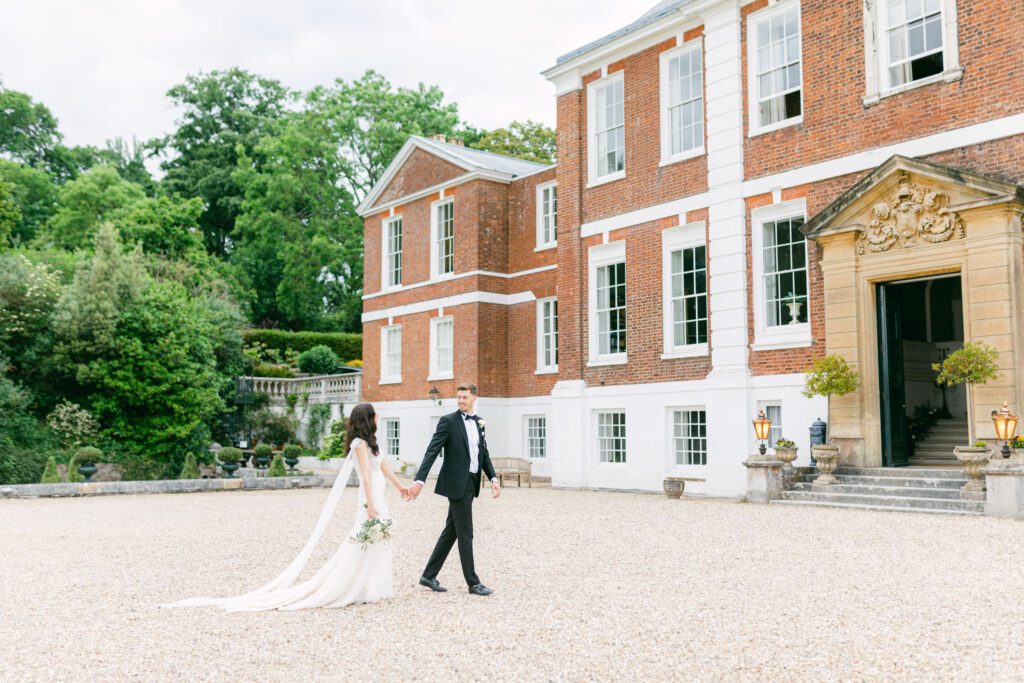 Bride and groom at black tie wedding at English Country House wedding venue, in Devon.