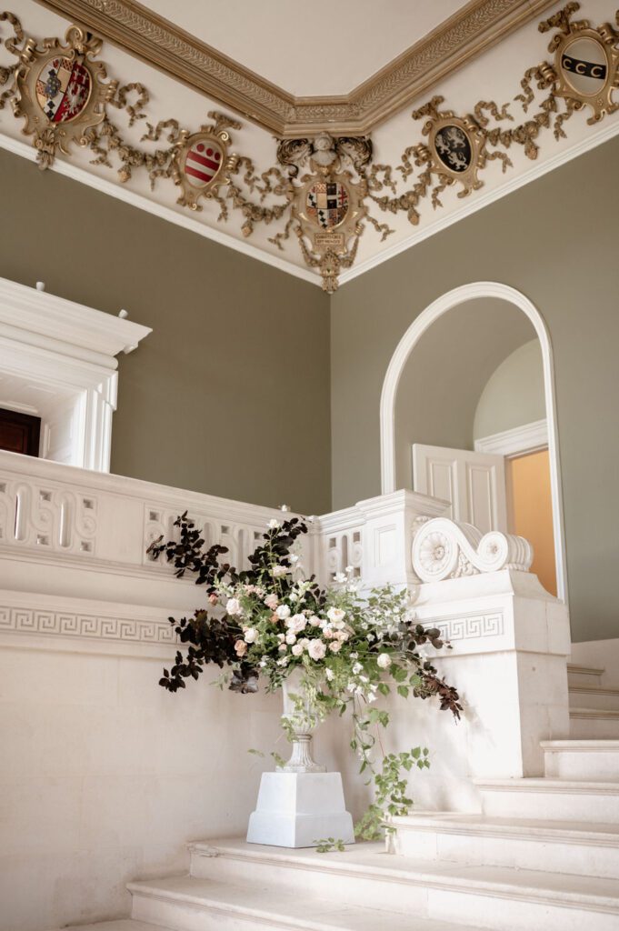 Urn floral arrangement in the Entrance Hall of Devon wedding venue, Pynes House.