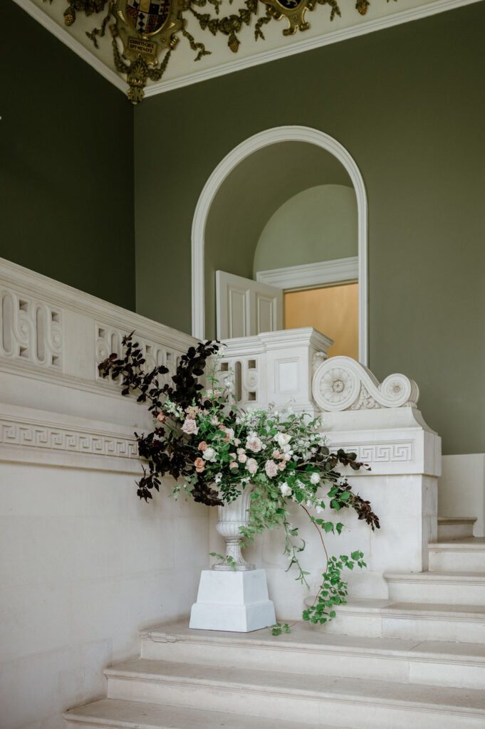 Urn with abundant flowers, at Devon wedding venue.