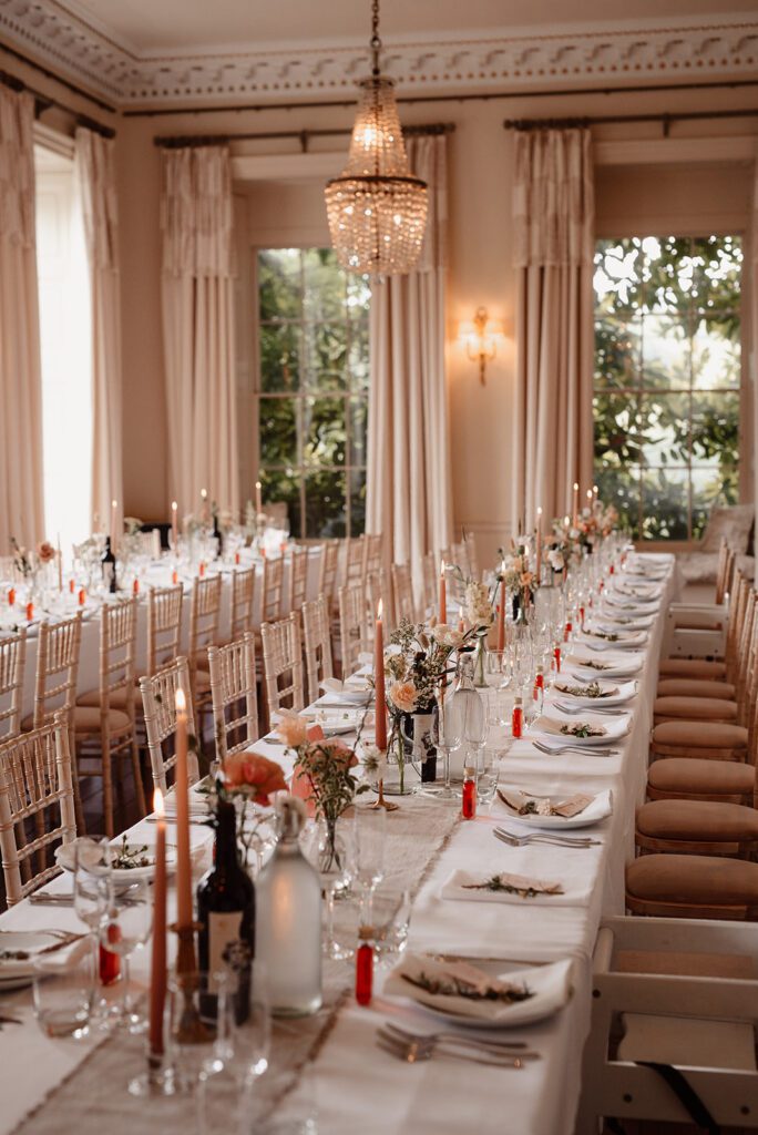A luxury reception layout at Pynes House, with seasonal flowers.