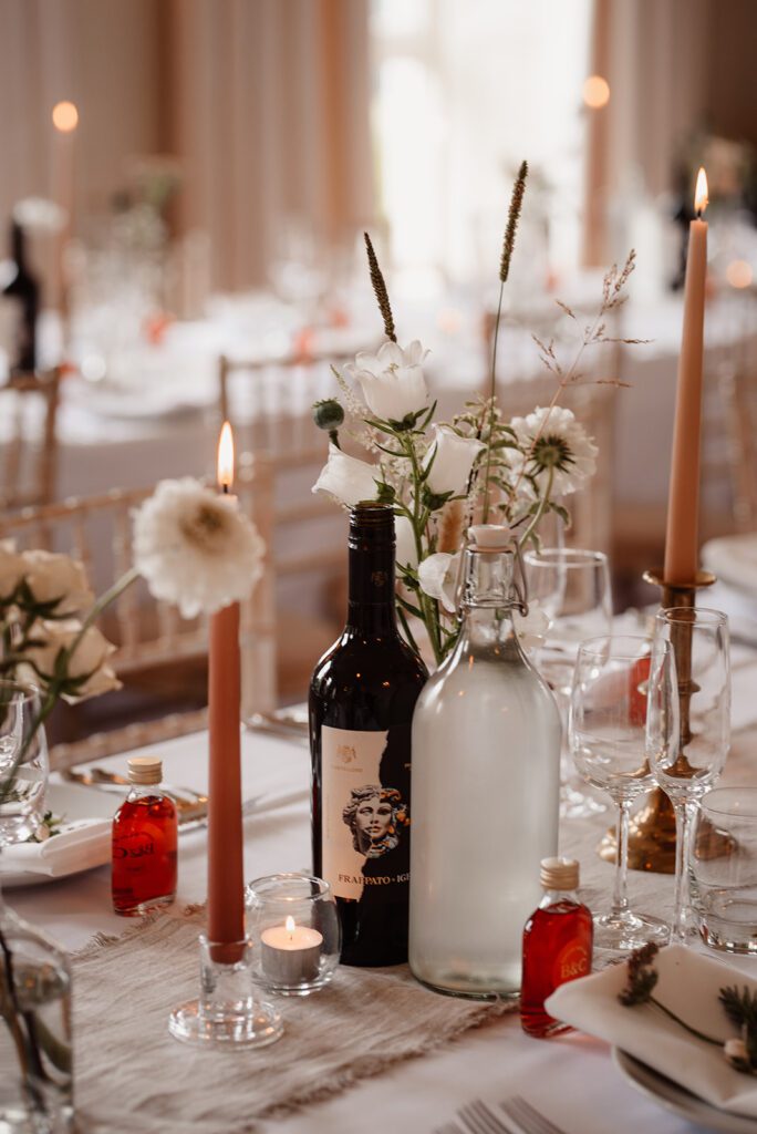 A seasonal flower arrangement for a table at a wedding breakfast.