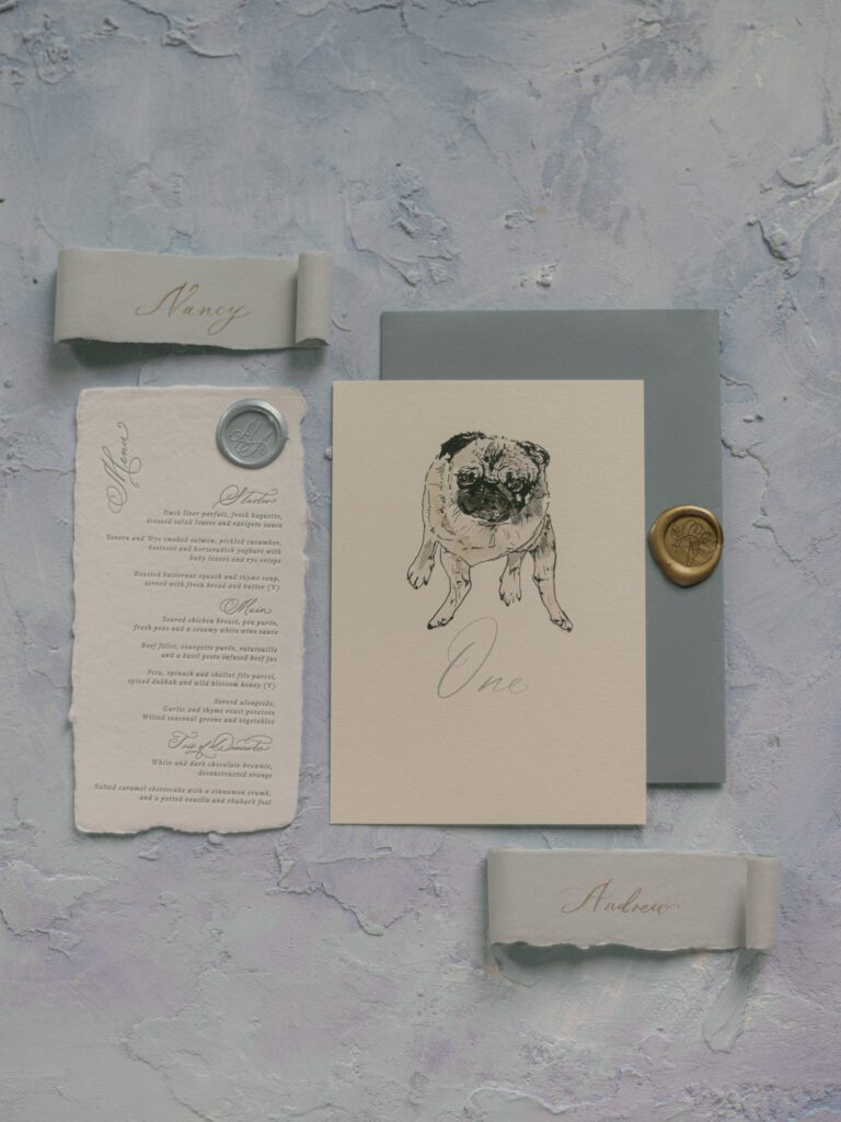 A stationery set with a pug for a luxury stately home wedding.