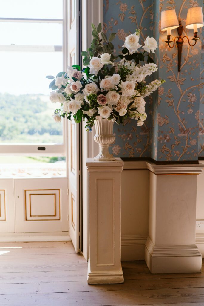 A large floral arrangement of pastel wedding flowers.