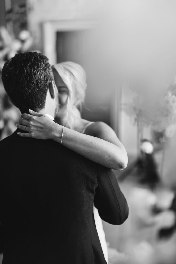 A bride and groom have their first kiss, during the wedding ceremony.