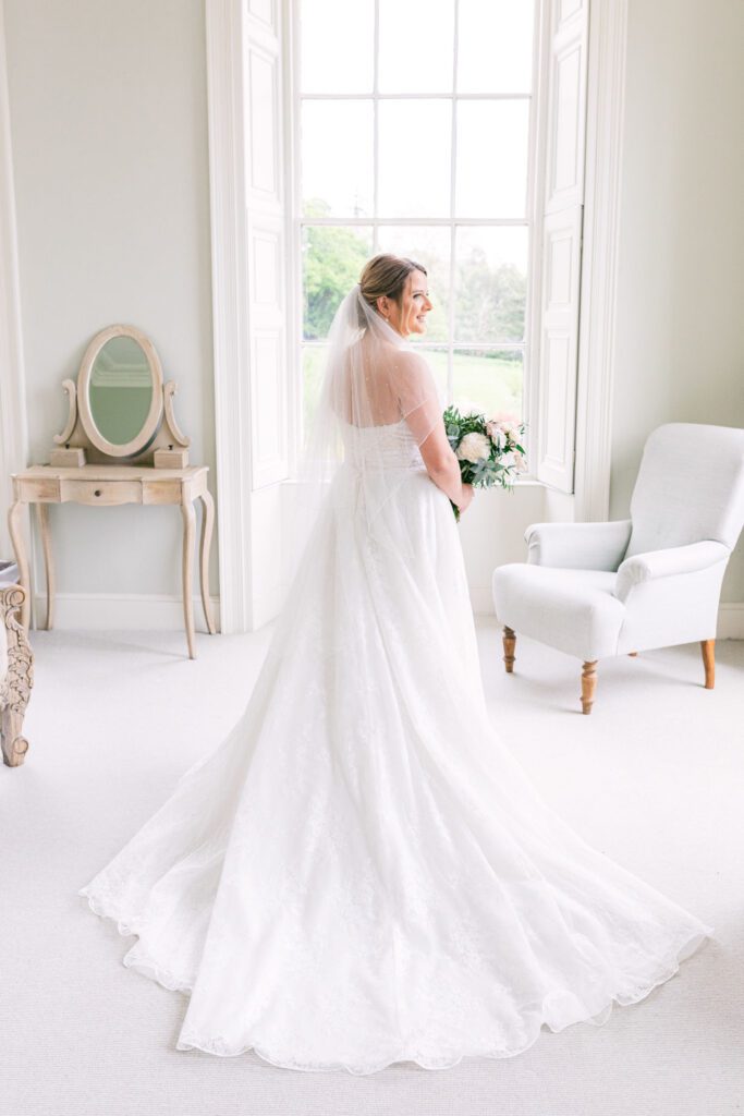 A bride before her English country house garden wedding at Pynes House