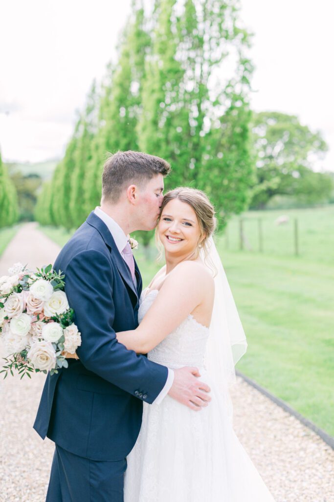 A bride and groom enjoy a quiet moment for couple photos