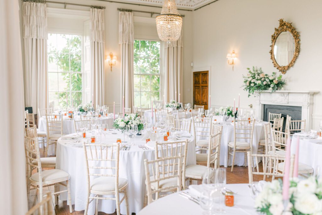 A light and airy reception layout for an English country garden wedding at Pynes House in Devon