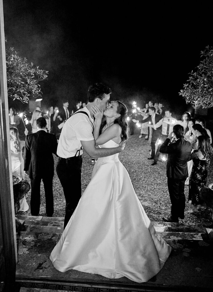 A bride and groom embrace during a destination wedding at Pynes House