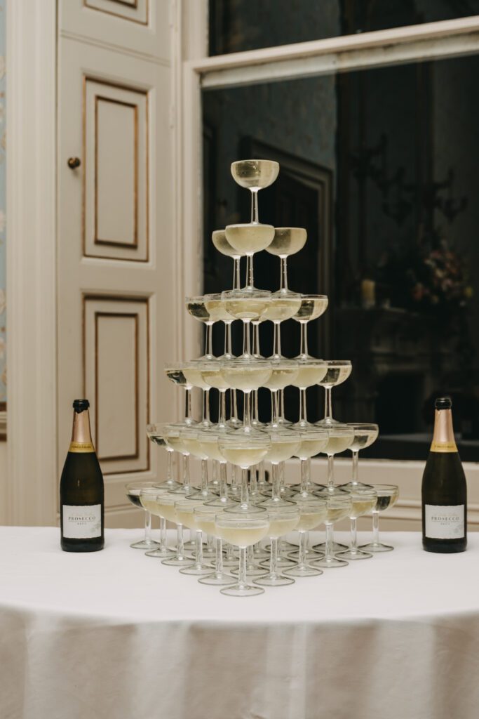 Wedding entertainment ideas of a champagne tower at a luxury wedding at Pynes House