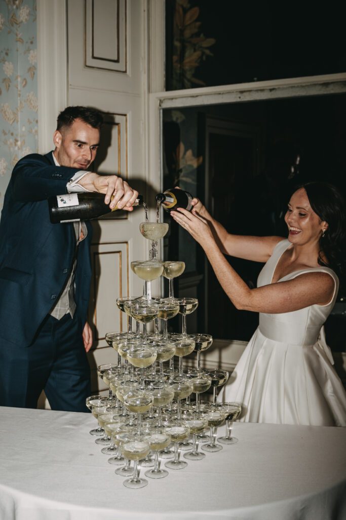Wedding entertainment ideas of a champagne tower at a luxury wedding at Pynes House