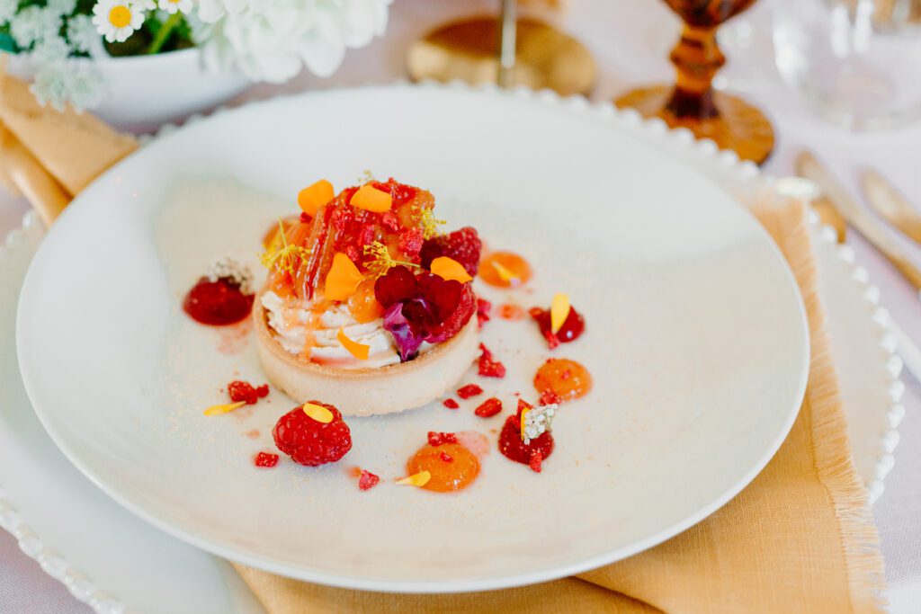 A sustainable dessert with of lemon tart with fruit, for a country house wedding