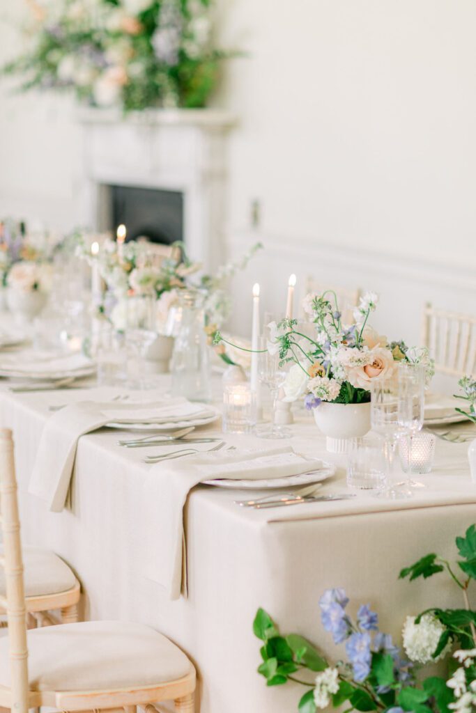 Abundant florals and candles for an elegant country house wedding breakfast