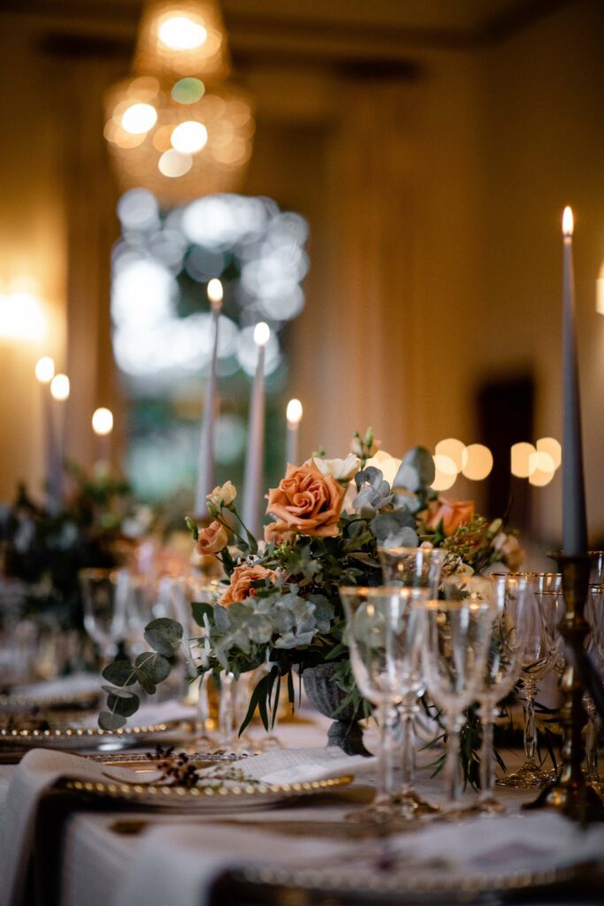 Crystal glasses and candles at a luxury winter wedding venue in Devon